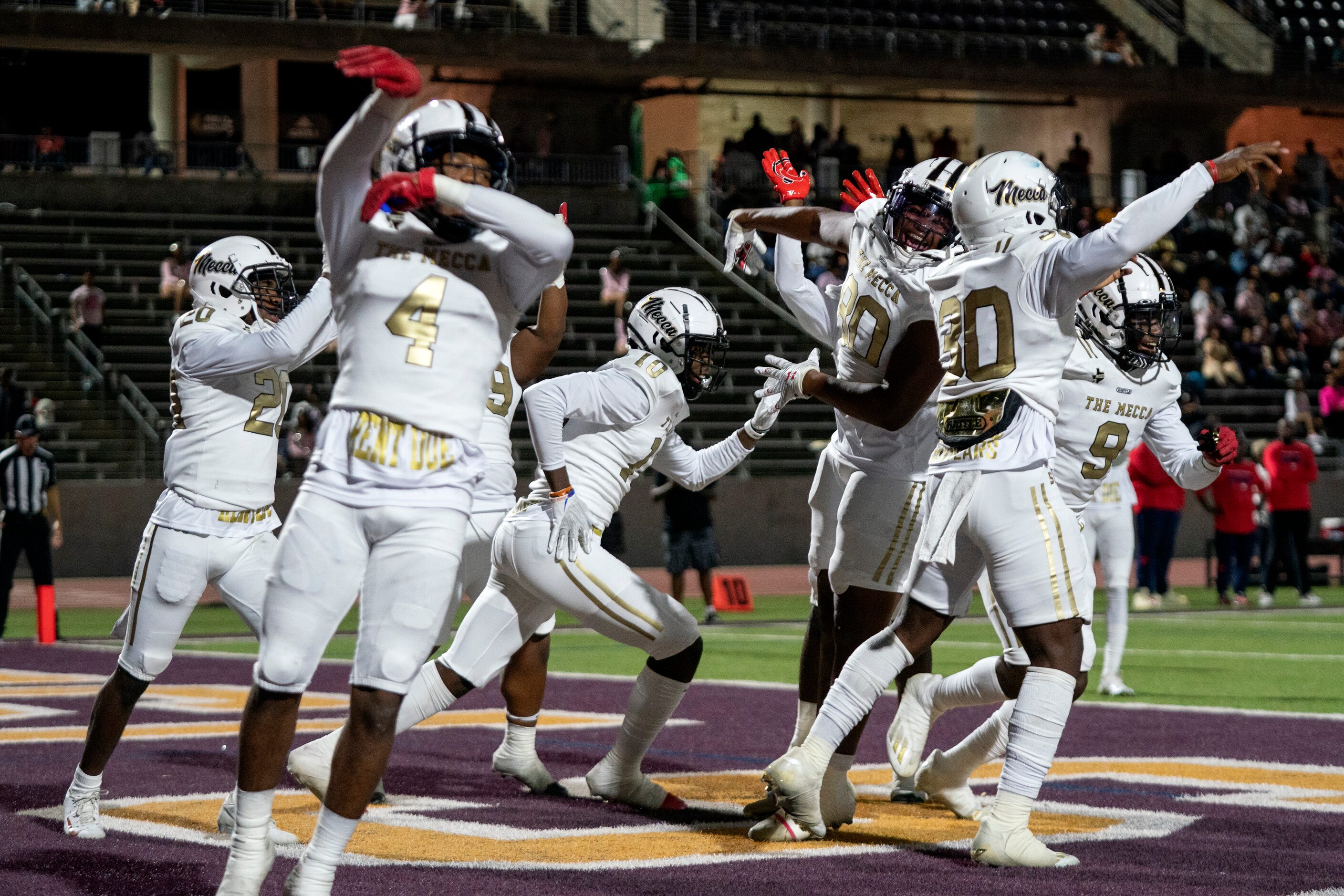 South Oak Cliff players celebrate an interception returned for a touchdown by senior...