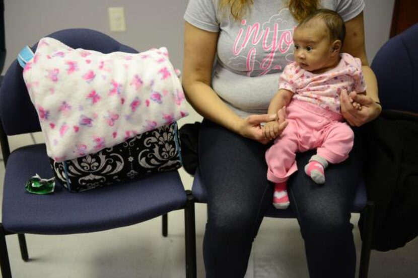 
Tracy Germait holds her 2-month-old daughter, Isis.
