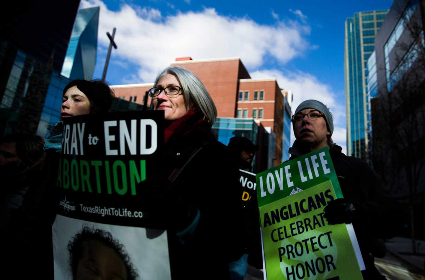 Demonstrators march from Cathedral Shrine of the Virgin of Guadalupe to Earle Cabell Federal...