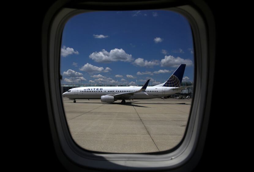 A United Airlines jet taxis to a gate at O'Hare International Airport in Chicago.