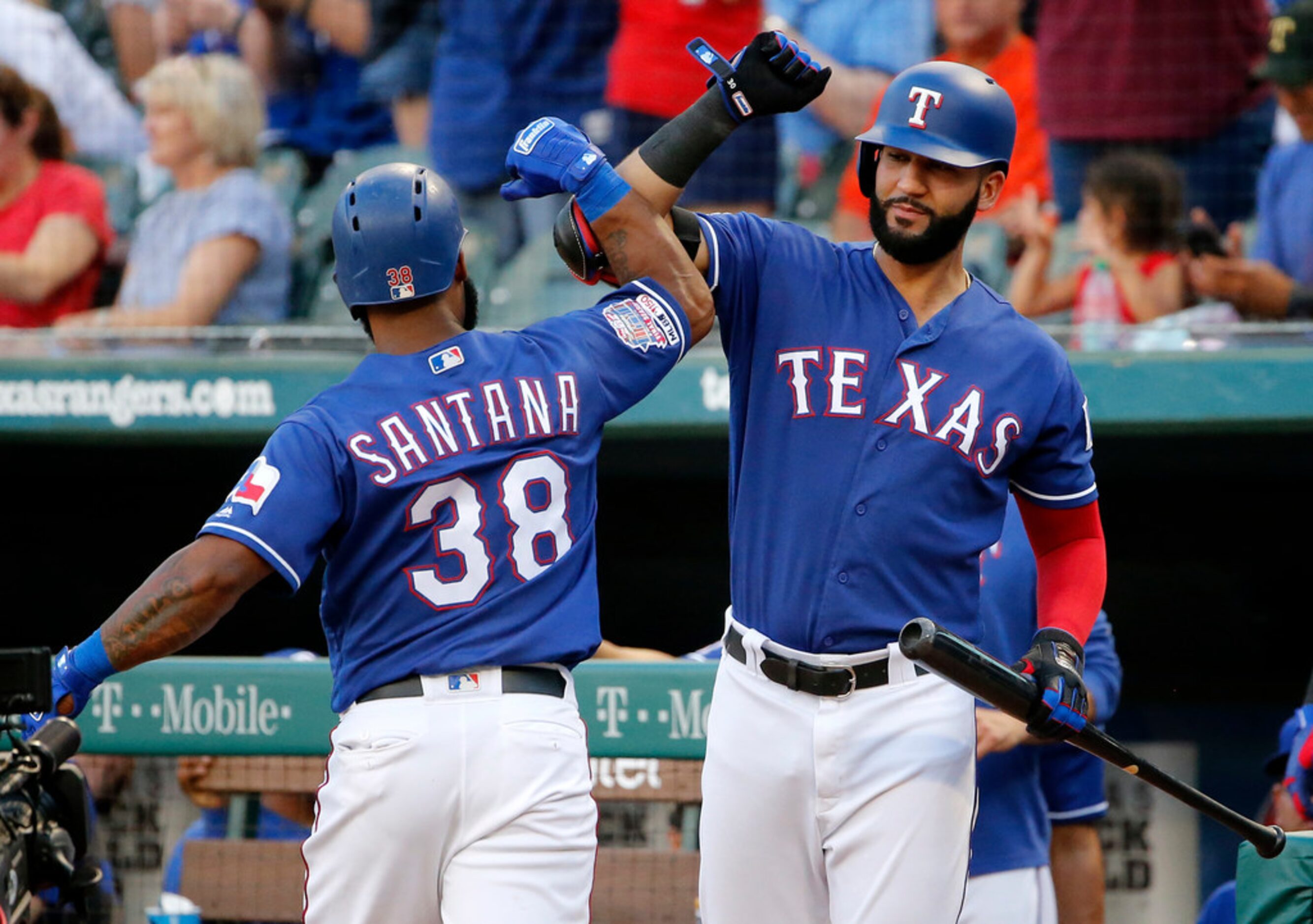 Texas Rangers Danny Santana (38) is congratulated by Nomar Mazara after hitting a solo home...