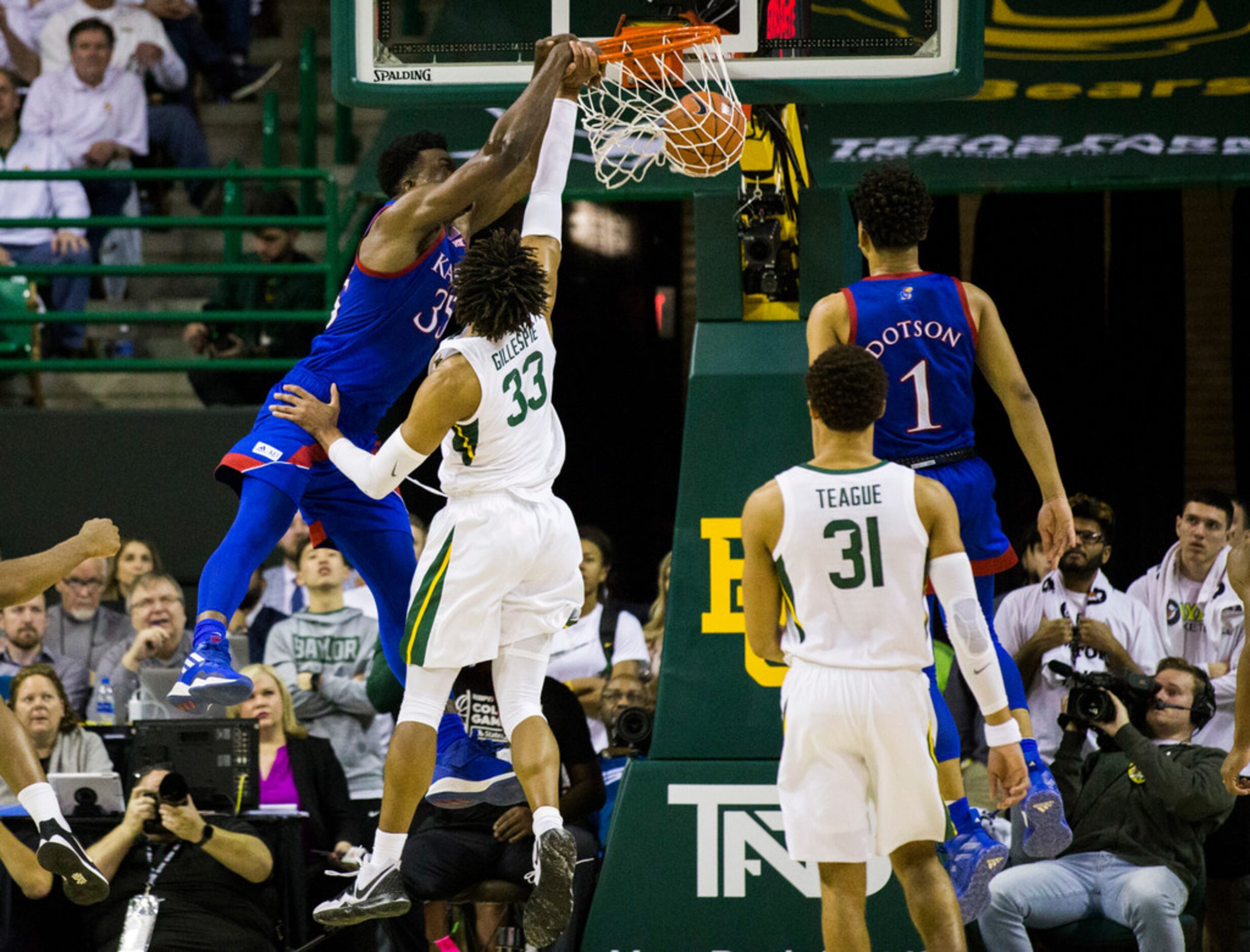 Kansas Jayhawks center Udoka Azubuike (35) dunks over Baylor Bears forward Freddie Gillespie...