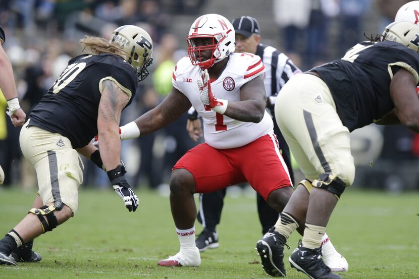 Nebraska defensive tackle Maliek Collins (7) works against Purdue guard Jordan Roos (70)...