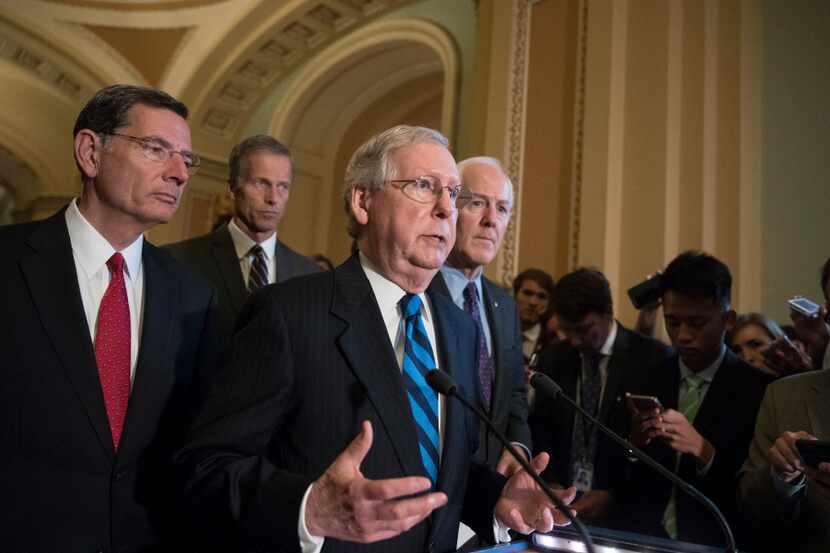 Senate Majority Leader Mitch McConnell of Ky., joined by, from left, Sen. John Barrasso,...
