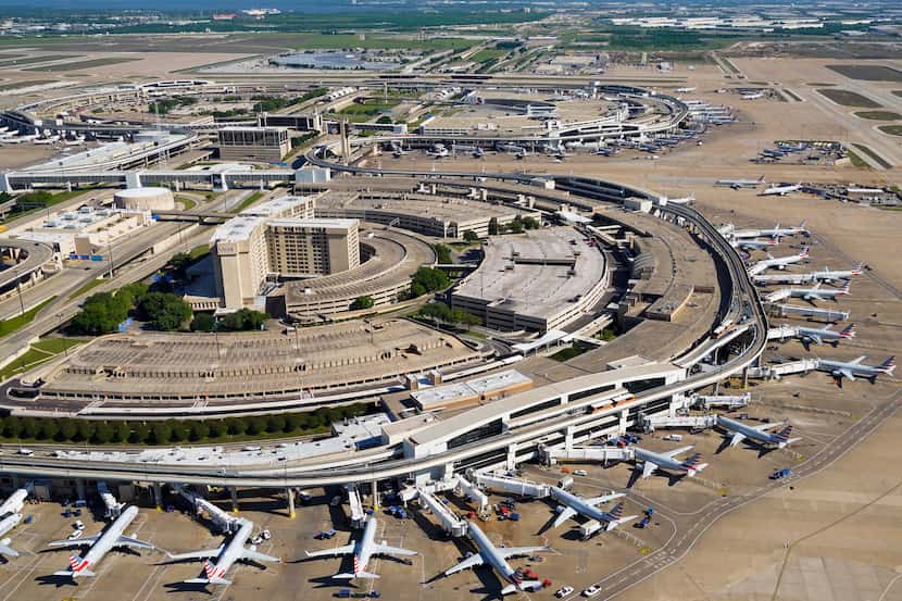 Aerial view of American Airlines aircraft at the gates of Terminal C (bottom) and Terminal A...