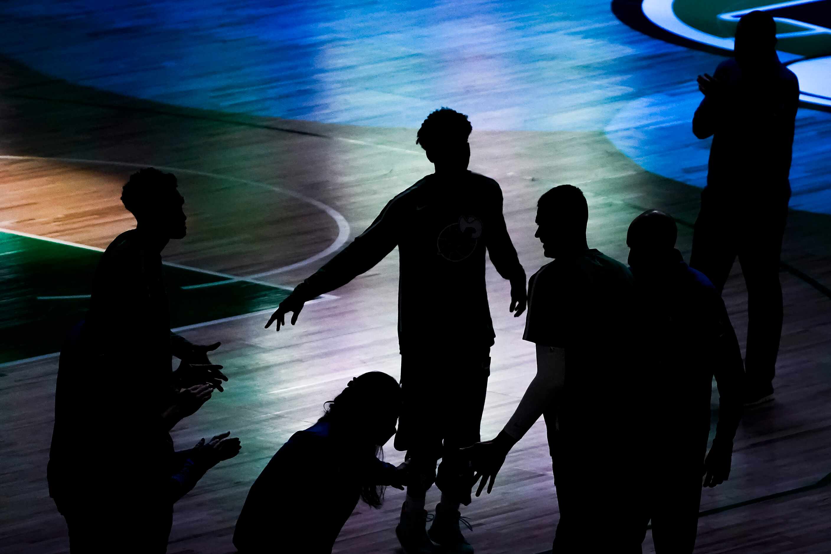 Dallas Mavericks center Kristaps Porzingis takes the court before an NBA basketball game...