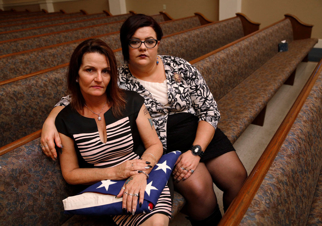 Deanna Staton (left) and Kati Wall pose for a portrait after the funeral of Dennis and Sara...