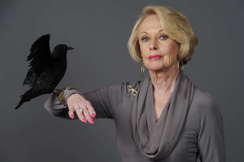 Tippi Hedren, star of the 1963 Alfred Hitchcock film "The Birds," poses with a prop bird in...