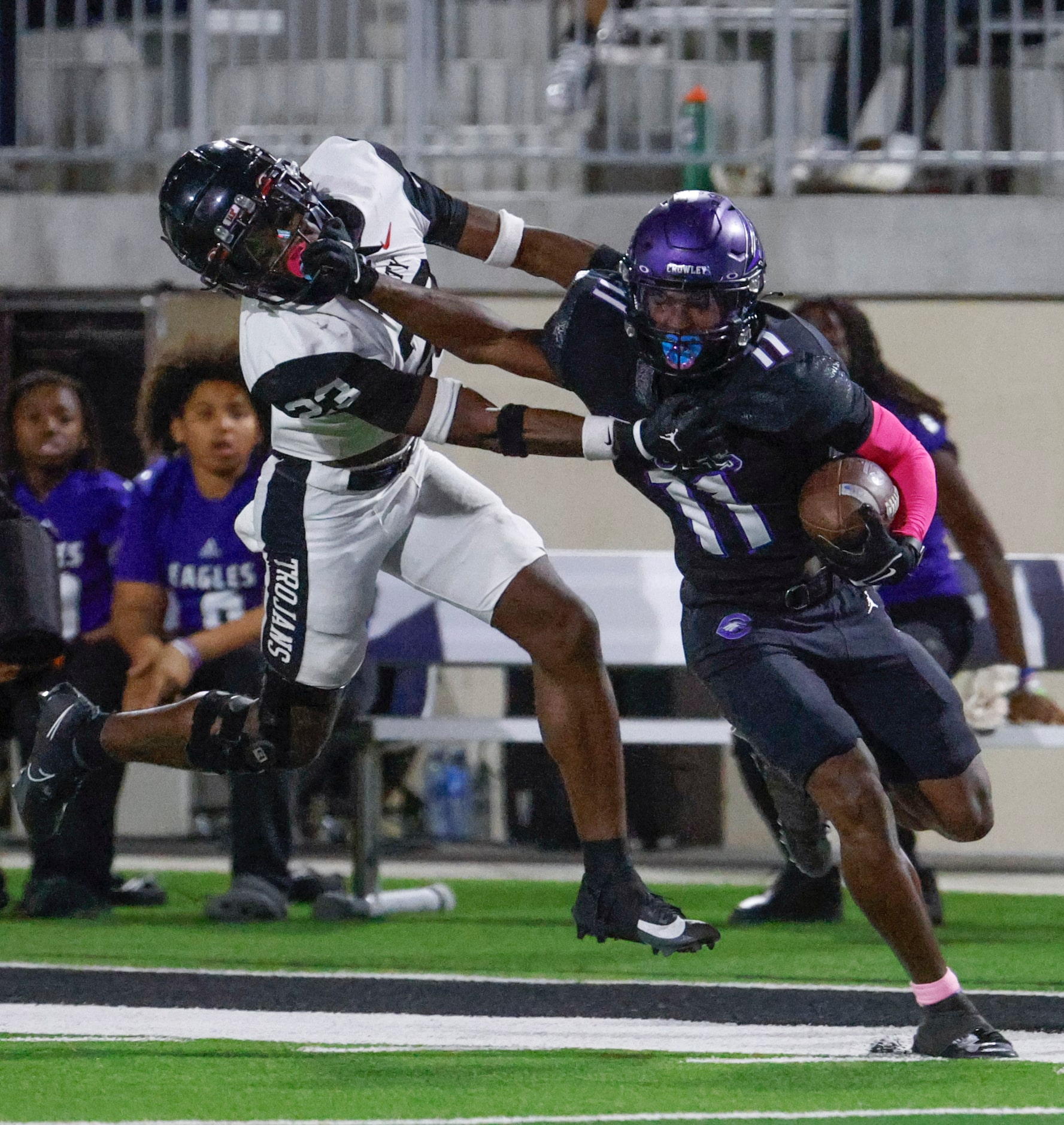 Trinity High’s Keondre Dixon (left) defends against Crowley High’s Curtis Johnson during the...