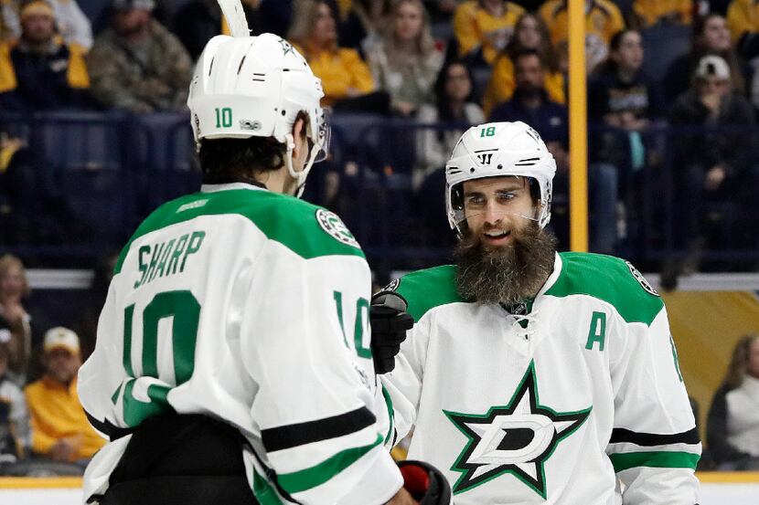 Dallas Stars right wing Patrick Eaves (18) congratulates left wing Patrick Sharp (10) after...