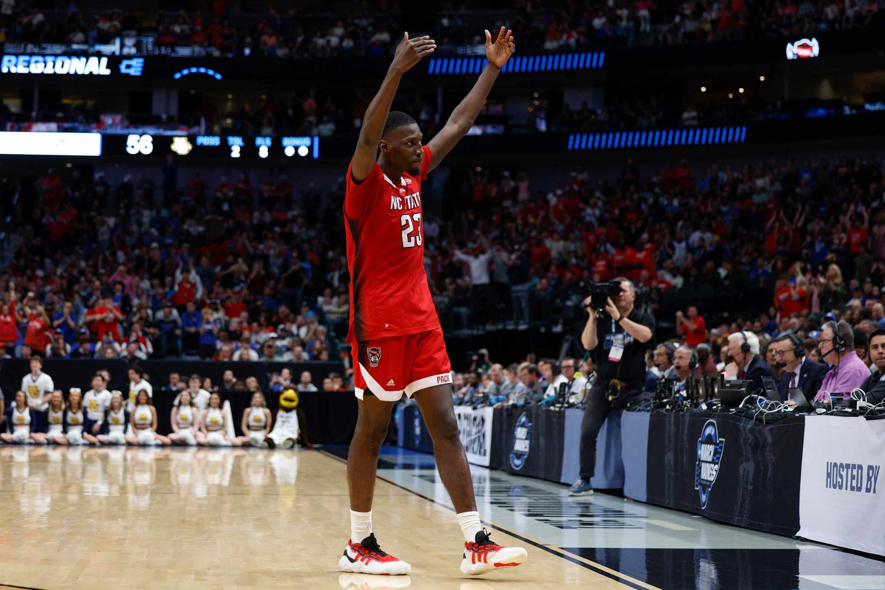 North Carolina State forward Mohamed Diarra (23) pumps up the crowd during the second half...