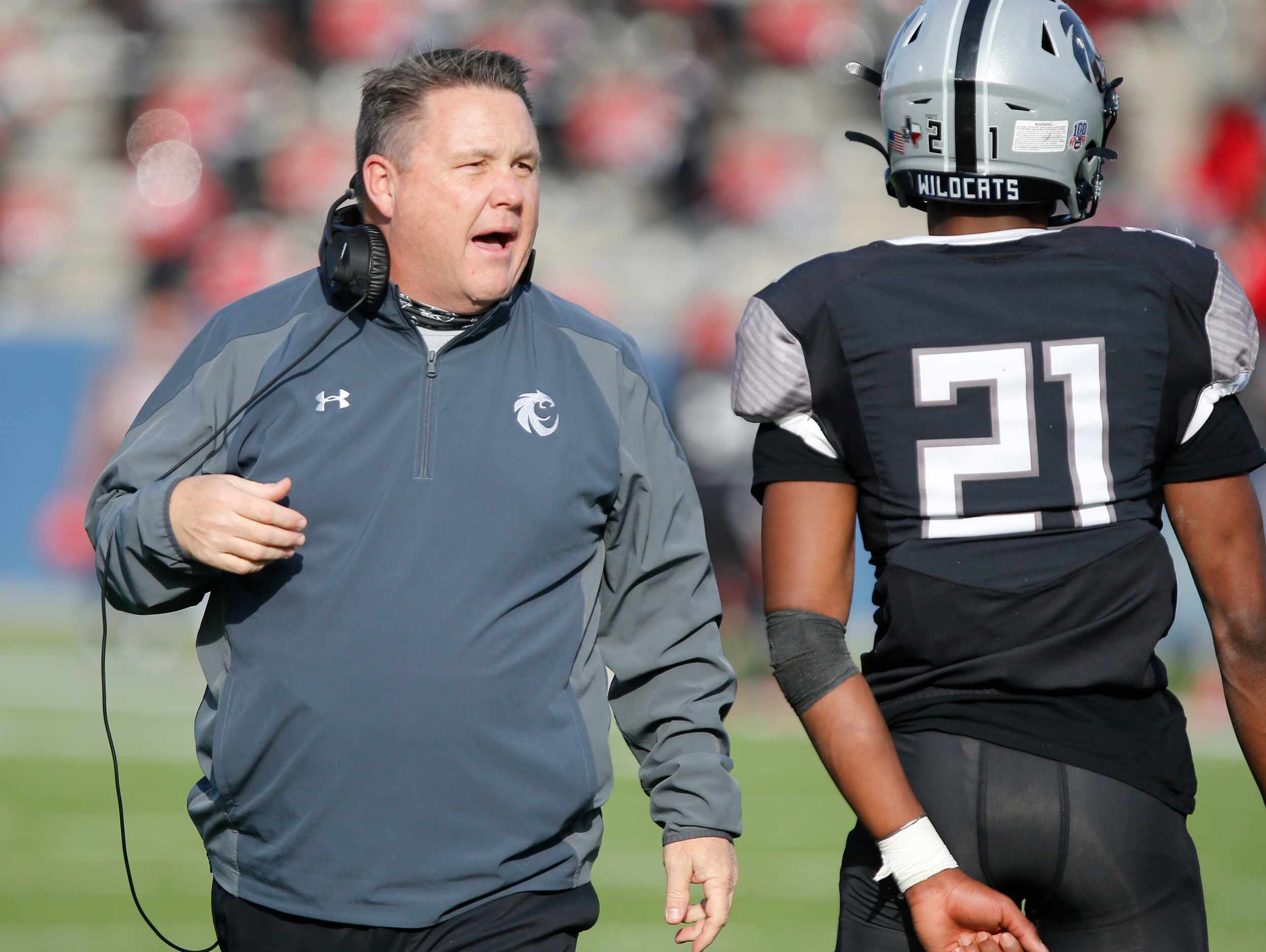 Denton Guyer High School head coach Rodney Webb encourages Denton Guyer High School...