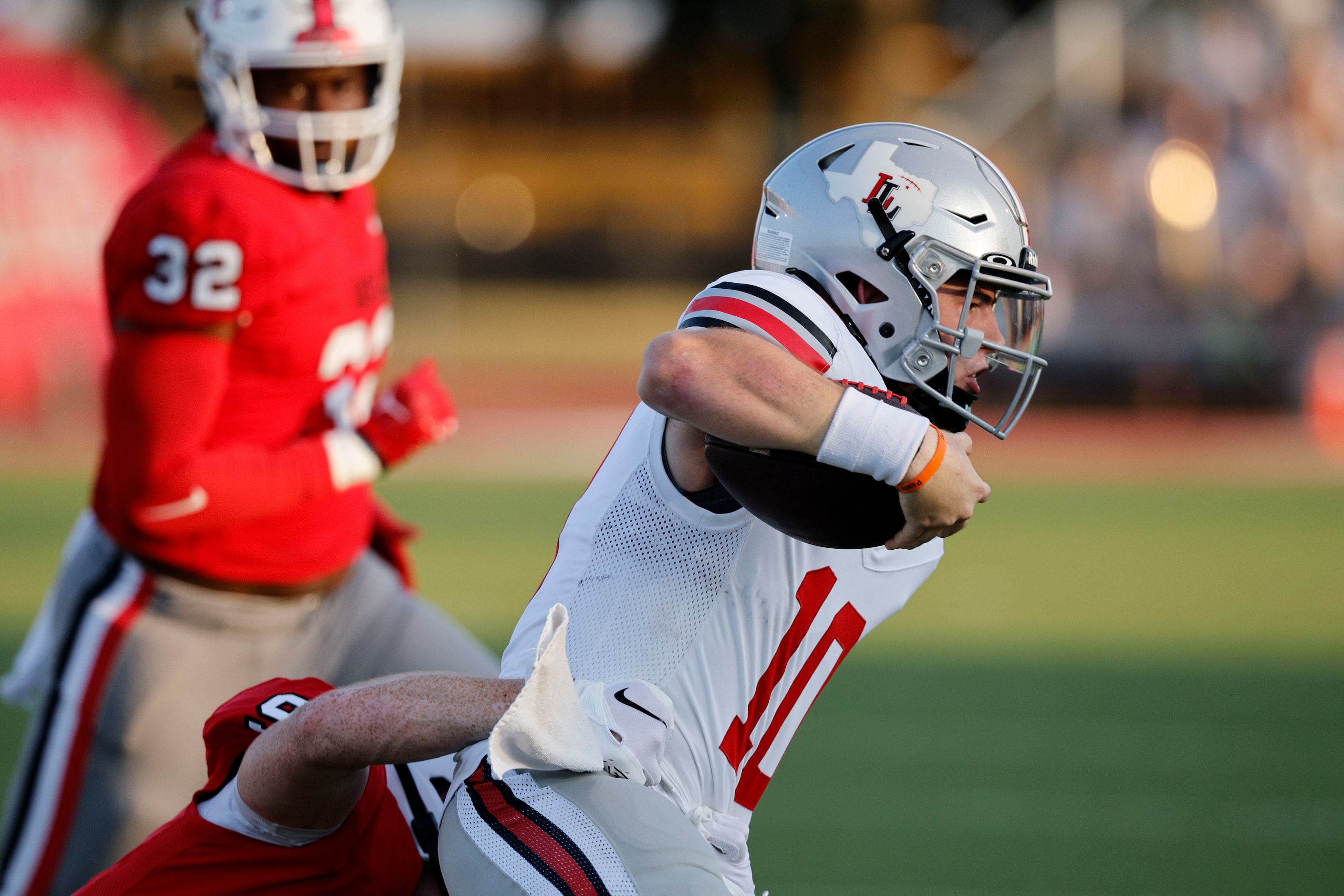 Lovejoy's Alexander Flanklin (10) carries the ball during the first half of a high school...