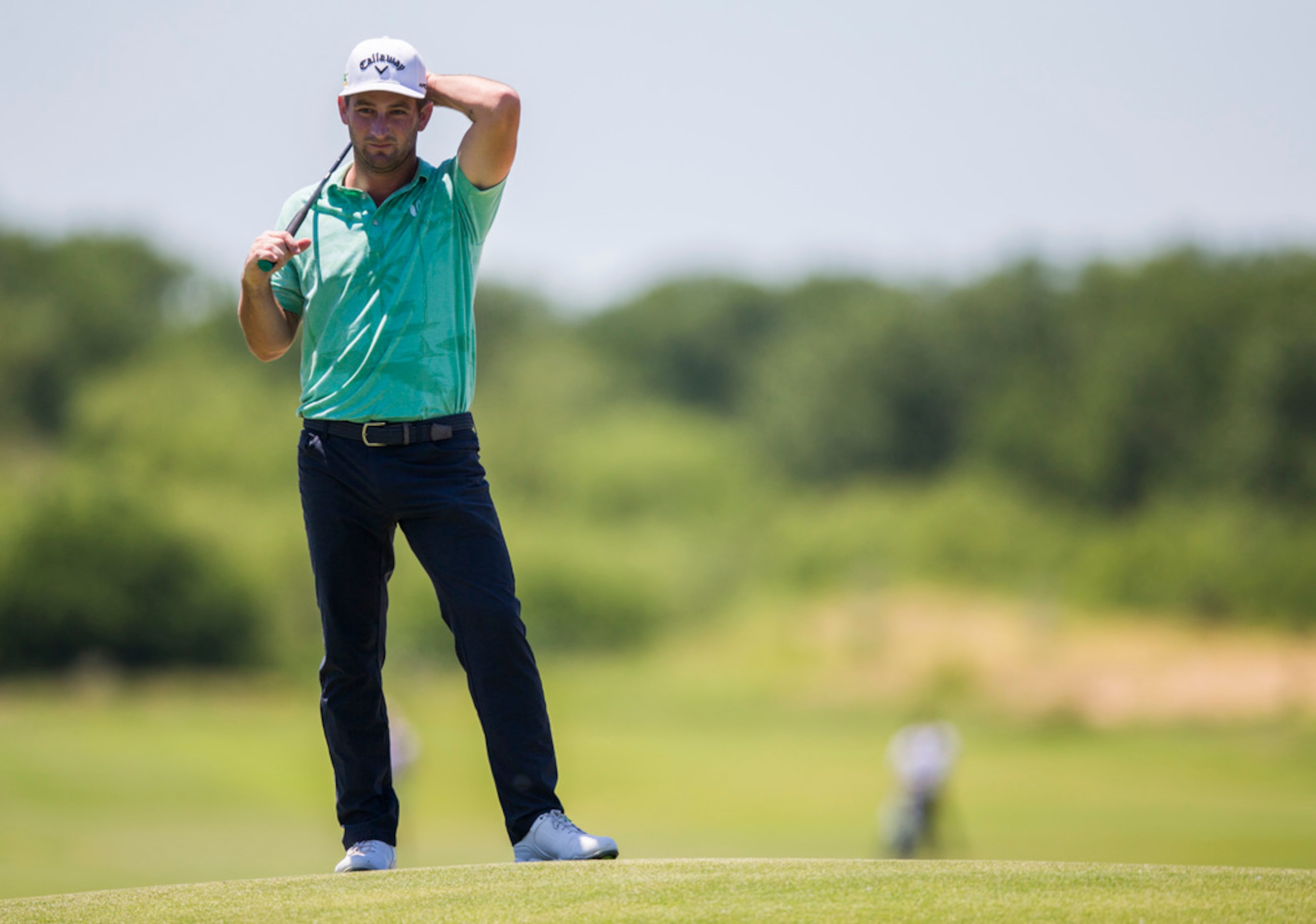 Matt Every stands on a hill near the third green during round 4 of the AT&T Byron Nelson...