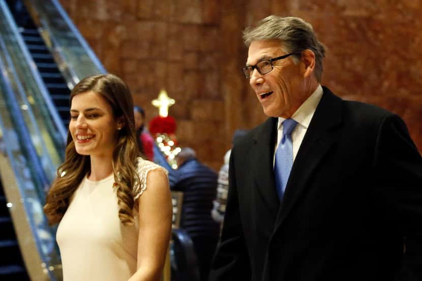 Former Texas Gov. Rick Perry enters Trump Tower with Trump aide Madeleine Westerhout for a...