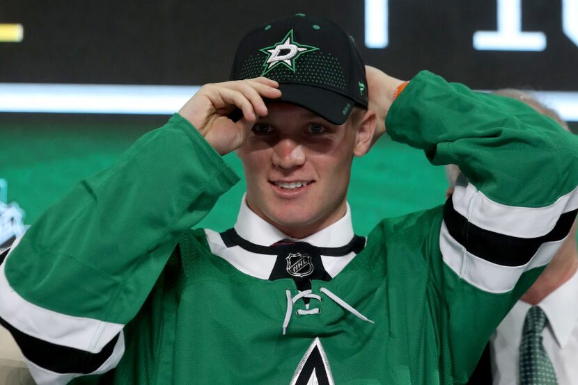 Ty Dellandrea poses after being selected thirteenth overall by the Dallas Stars during the...