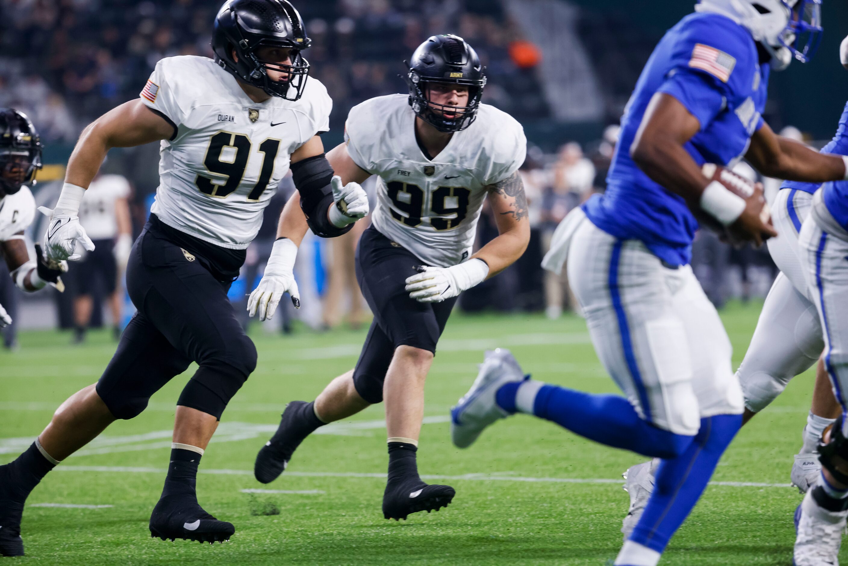 Army Black Knights defensive lineman Ryan Duran III (91) and Army Black Knights defensive...