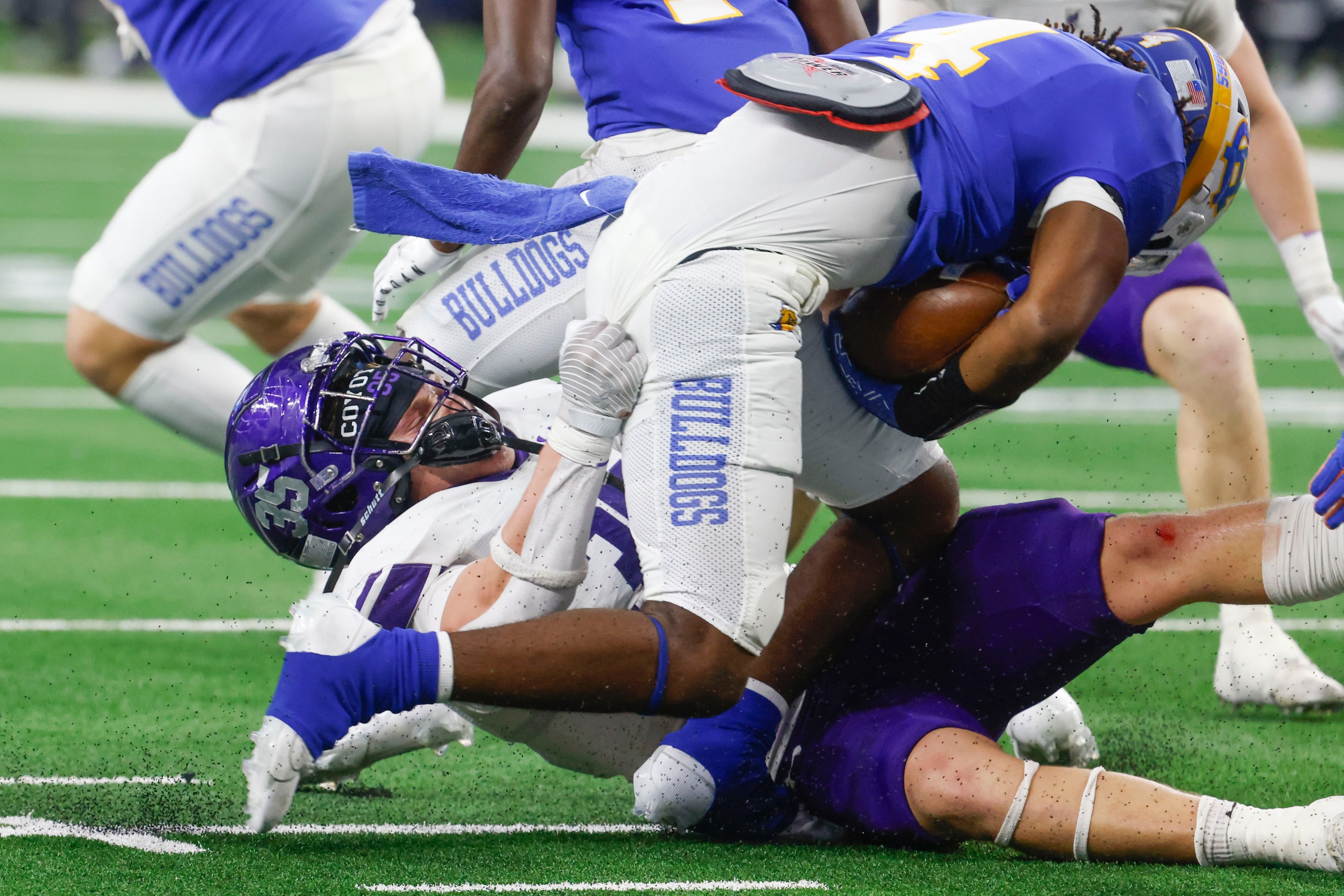 Anna High’s Cj Miller (bottom) brings down Tyler Chapel Hill’s Rickey Stewart during the...