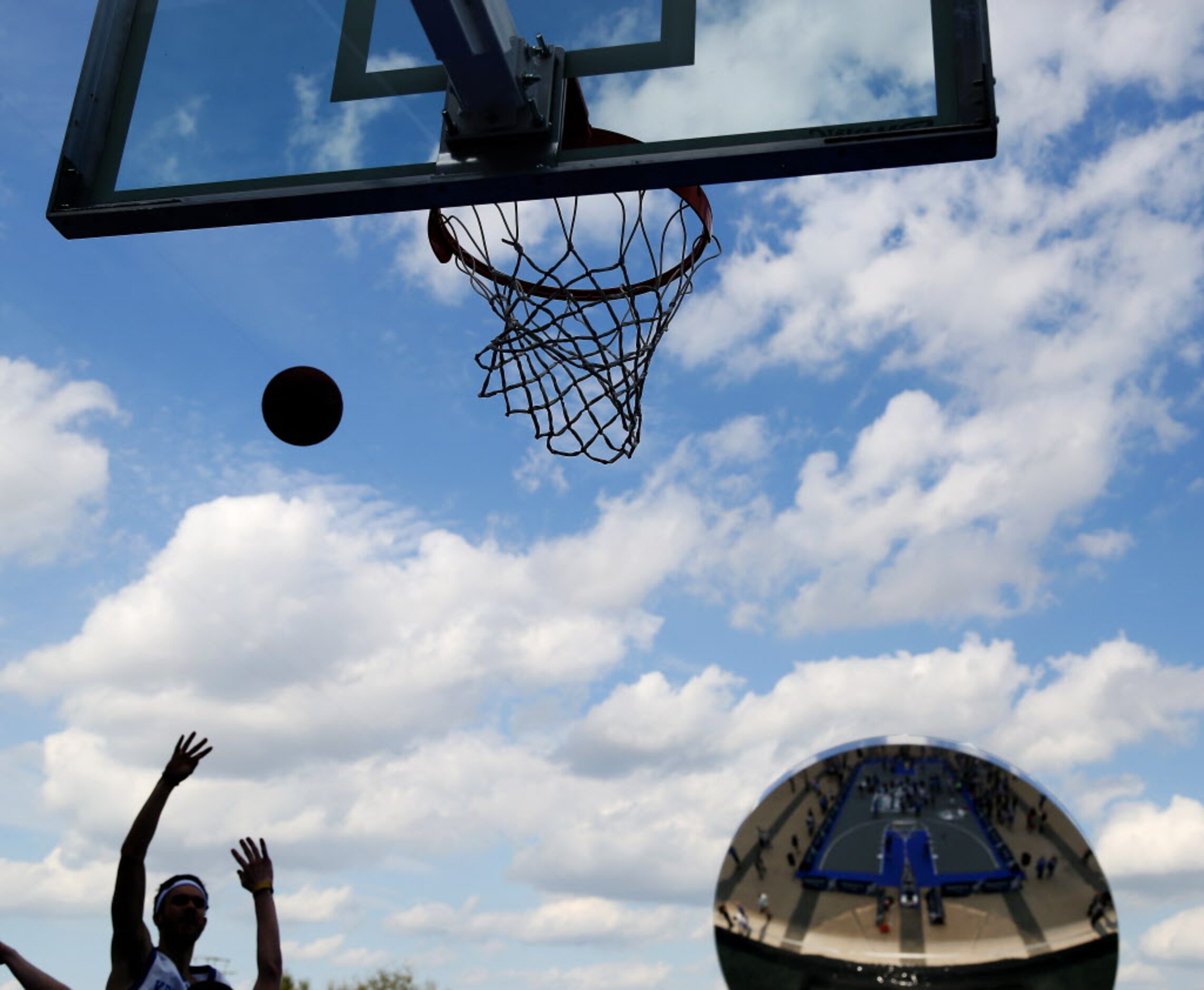 Fans play basketball on the main court at the Tip-Off Tailgate presented by Infiniti area on...