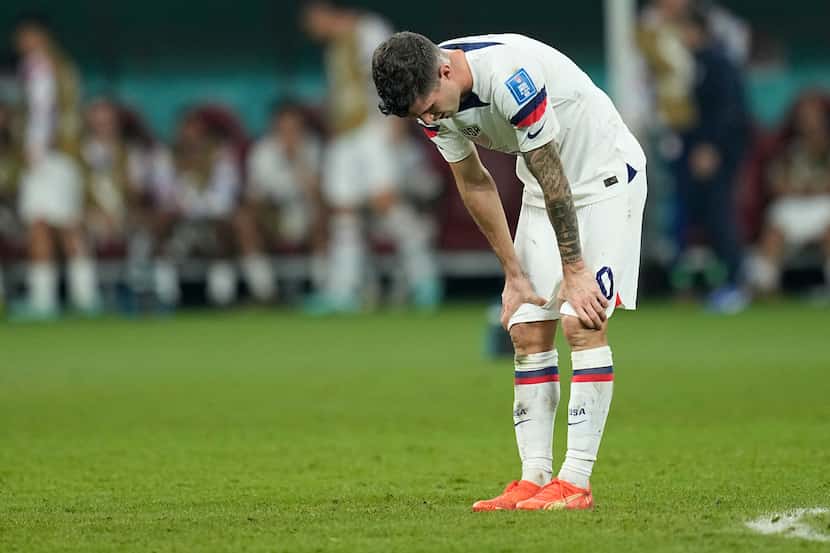 Christian Pulisic of the United States is dejected after the World Cup round of 16 soccer...