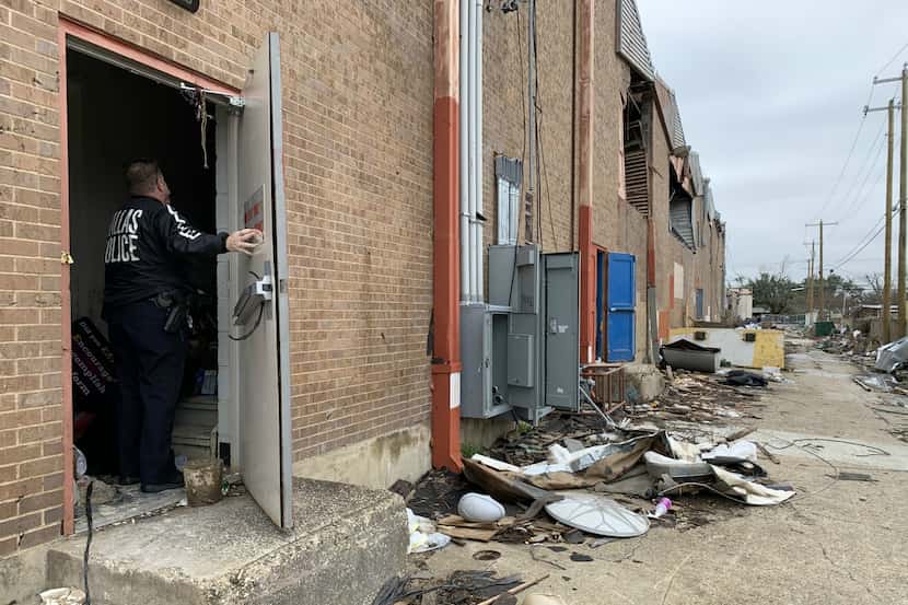 Dallas Police Lt. Kevin Campbell enters the unsecured back door to a pawn shop in the Marsh...
