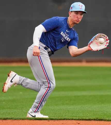 Texas Rangers minor league infielder Cam Cauley participates in a spring training workout on...