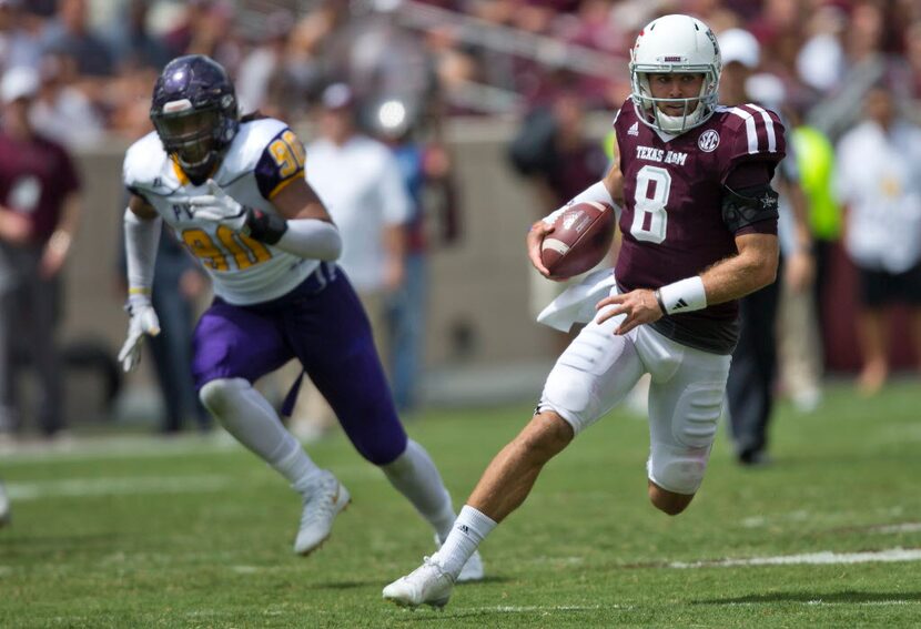 Texas A&M quarterback Trevor Knight (8) runs for a first down against Prairie View A&M...