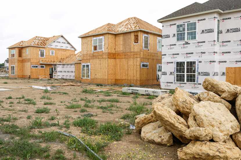 Single-family rental houses under construction at the Residences at Rayzor Ranch in Denton...