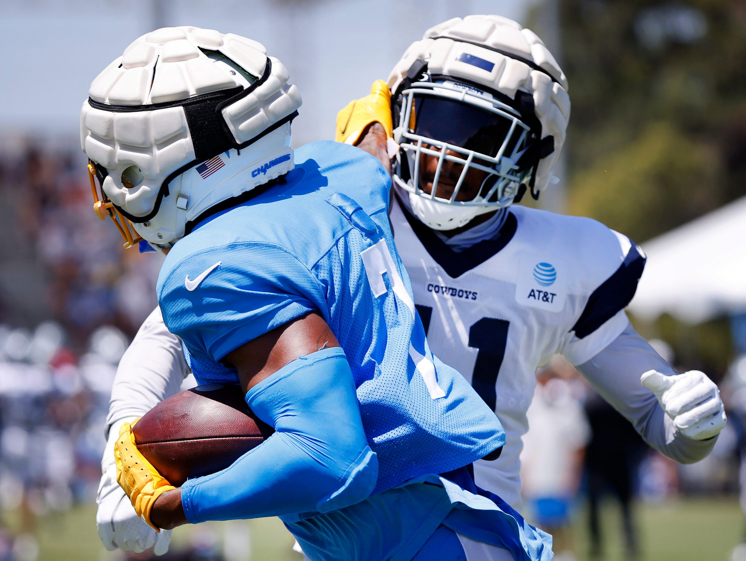 Dallas Cowboys linebacker Micah Parsons (11) tries to strip the ball from Los Angeles...