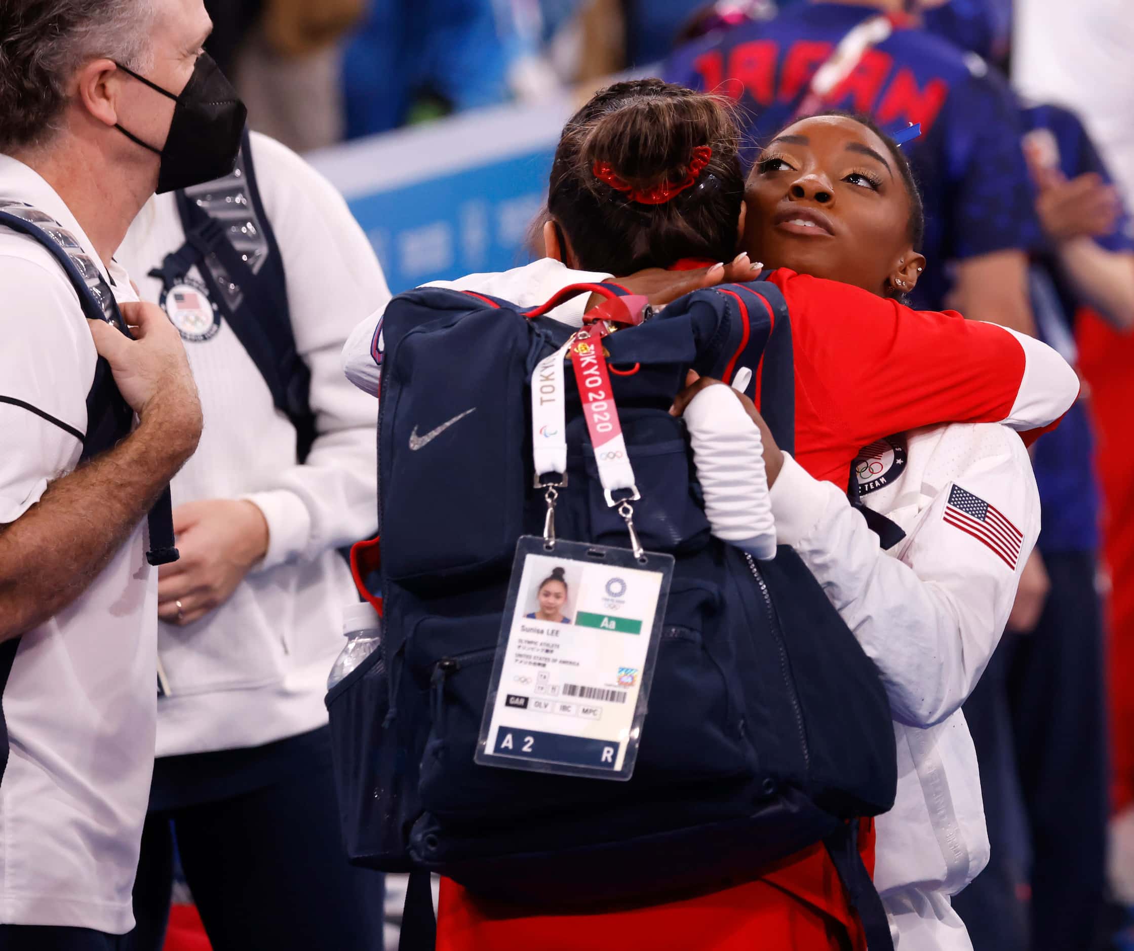 USA’s Simone Biles and Sunisa Lee hug after the women’s balance beam final at the postponed...