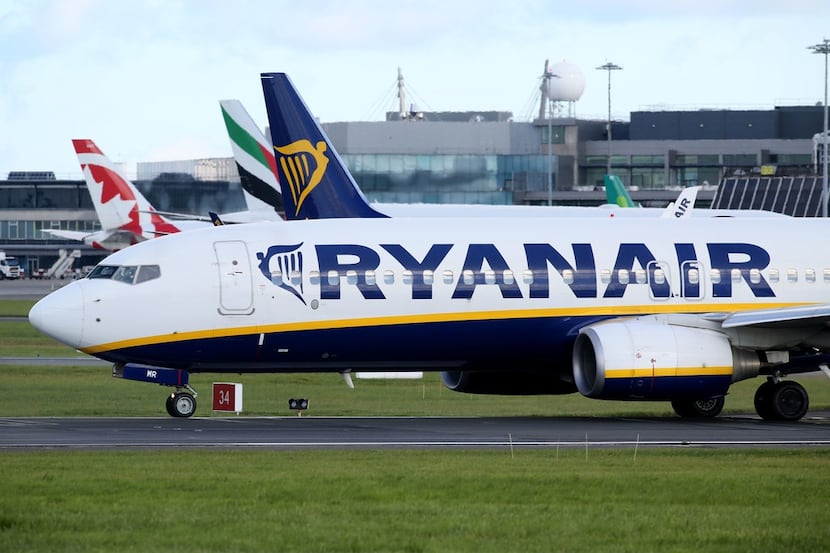(FILES) This file photo taken on September 21, 2017 shows 
A Ryanair plane parked on the...