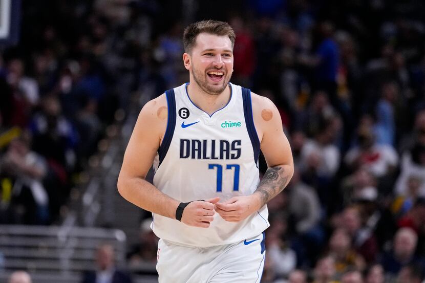Dallas Mavericks guard Luka Doncic (77) smiles after a basket against the Indiana Pacers...