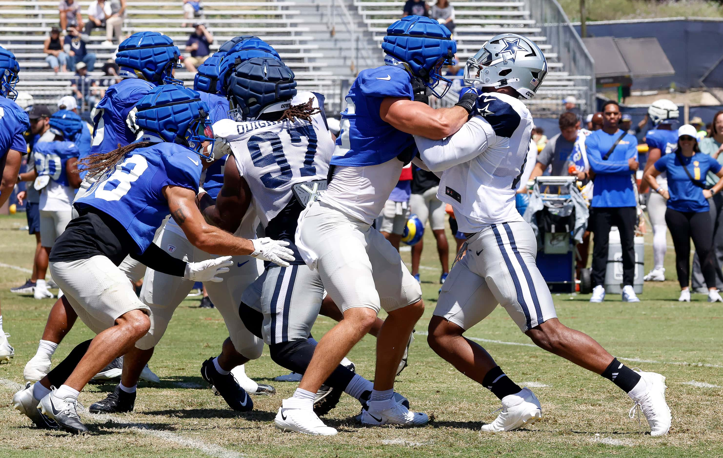 Dallas Cowboys linebacker Micah Parsons (11) is blocked by Los Angeles Rams tight end Colby...