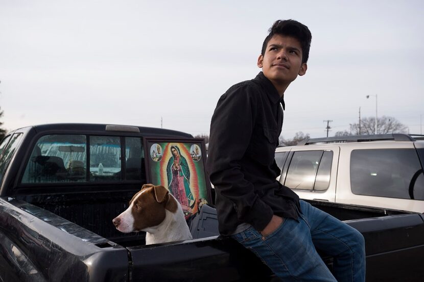 Luke Acosta, 14, and his dog, Skinny, slept in the back of his family's pickup Sunday night...