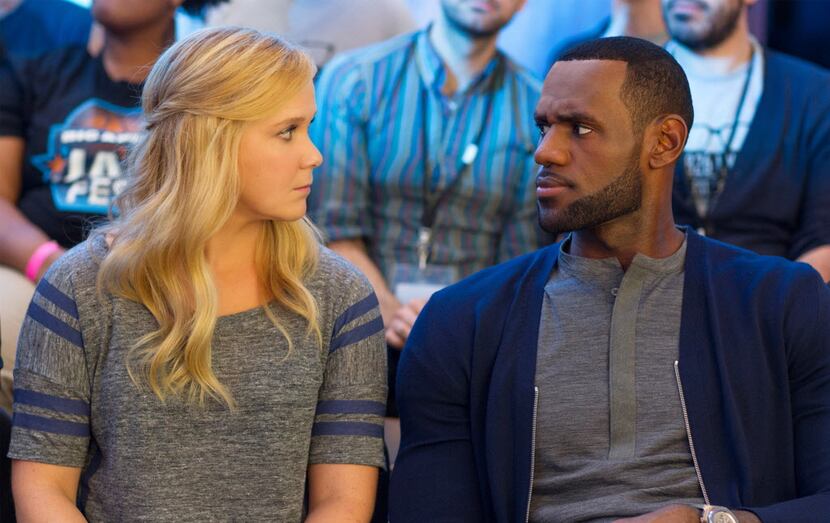 Amy Schumer and LeBron James in a scene from "Trainwreck" 