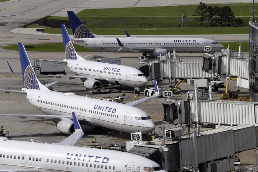 United Airlines planes are parked at their gates at George Bush Intercontinental Airport in...