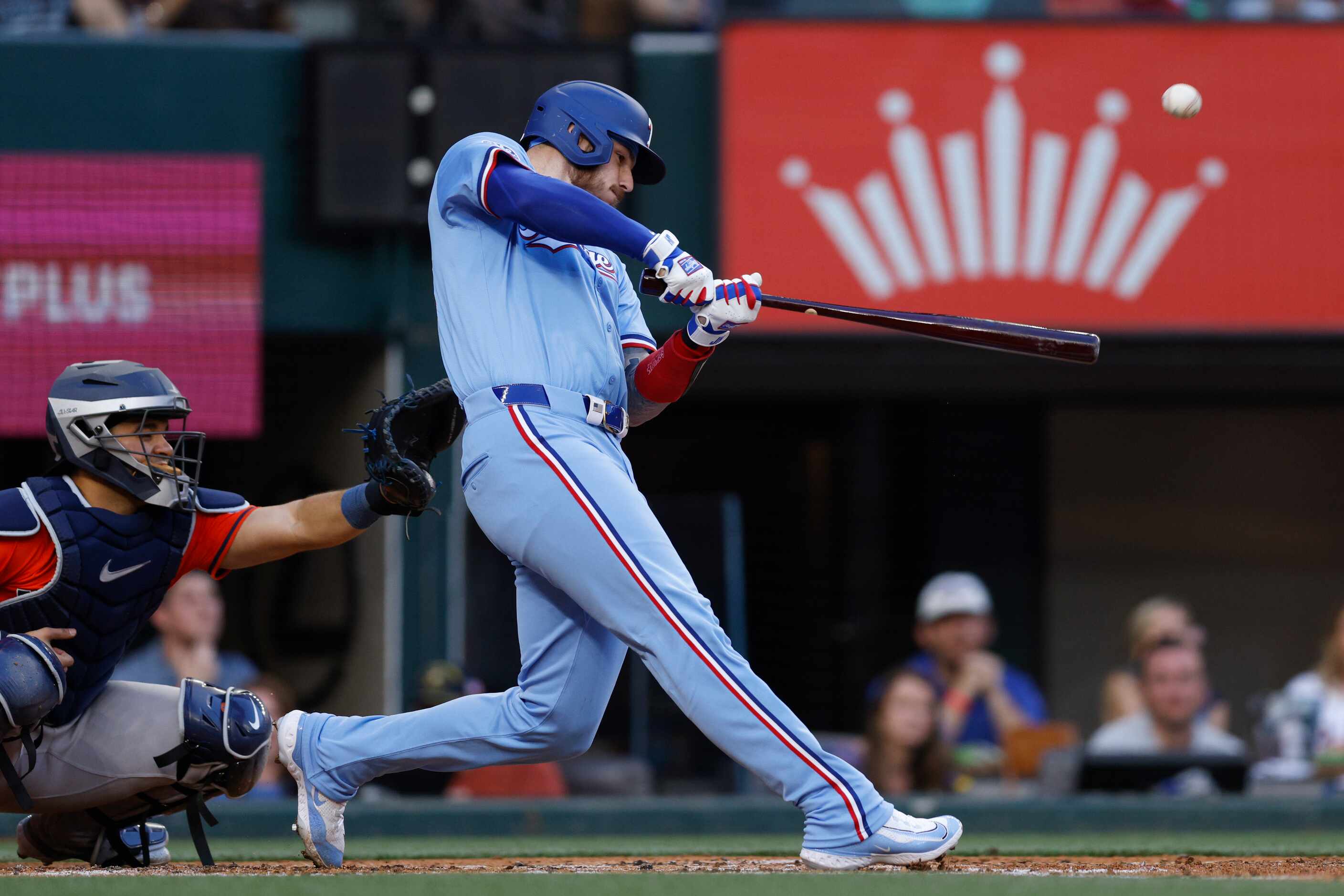 Texas Rangers catcher Jonah Heim flies out to center during the second inning against the...