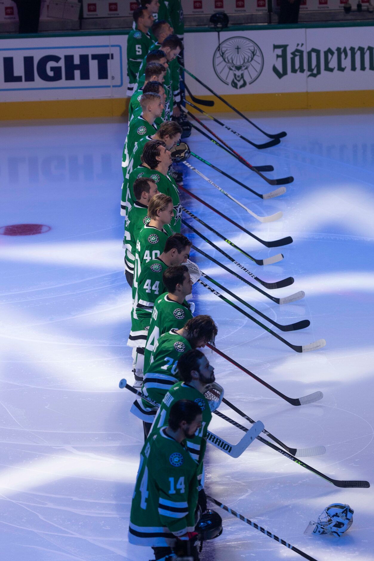 Dallas Stars stand for the national anthem before the start of Dallas Stars home opener...