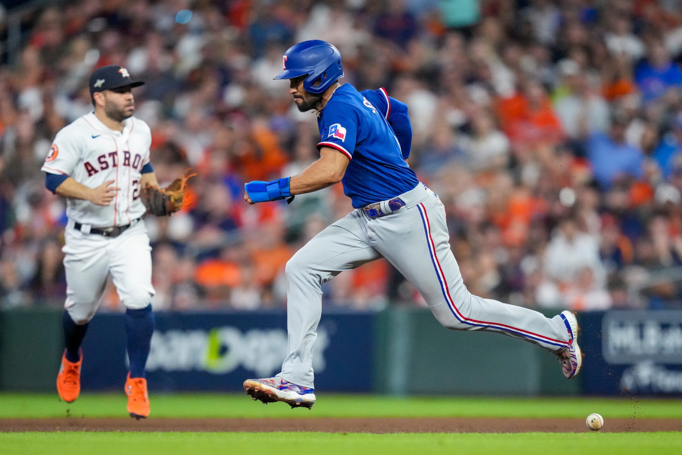 Texas Rangers second baseman Marcus Semien (2) advances to second base after a single by...