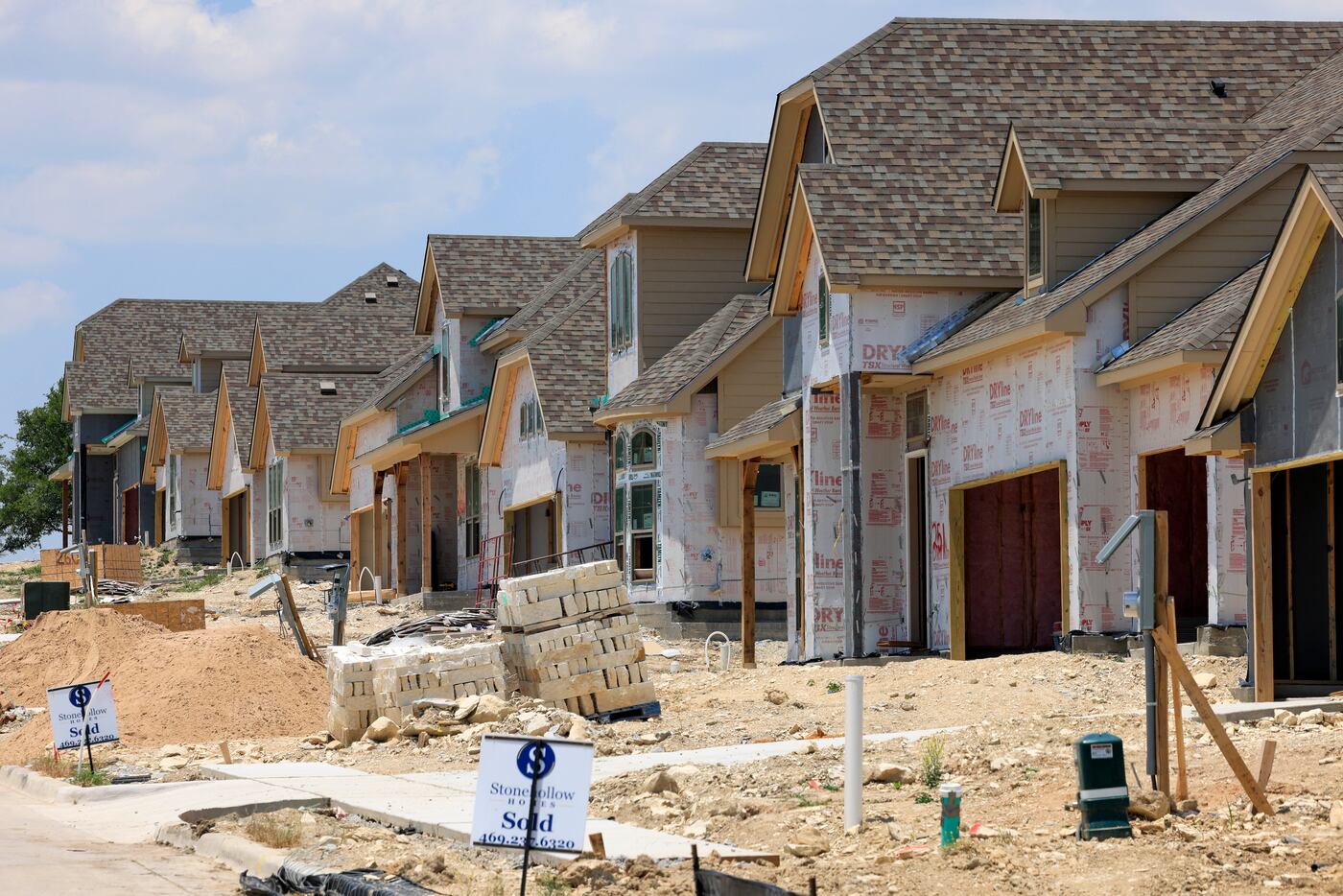 A row of houses under construction in Sherman in June.