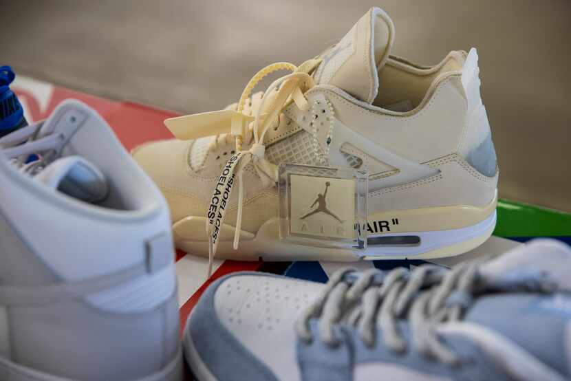 Plugged in ORL co-owners display a Nike X Off-White Air Jordan 4 off-white sail sneaker,...
