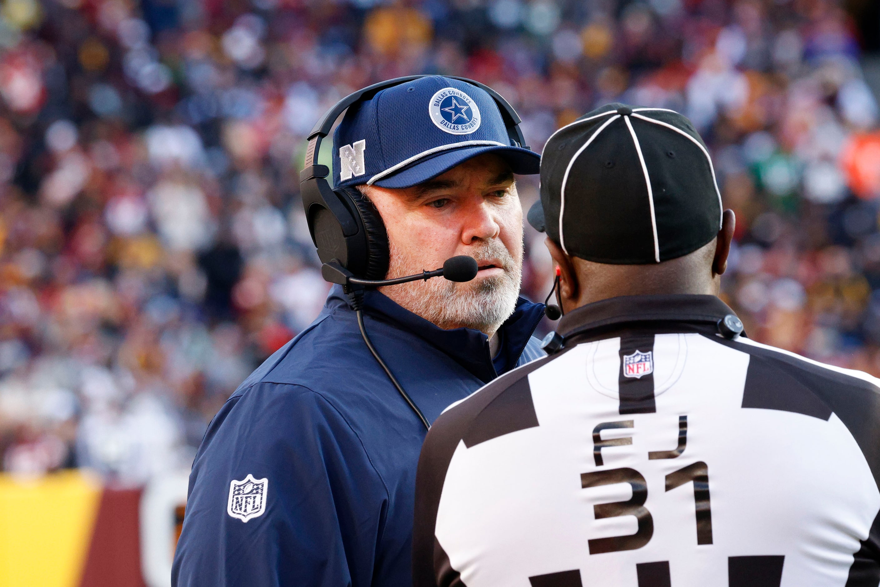 Dallas Cowboys head coach Mike McCarthy talks with a referee in the second half of an NFL...