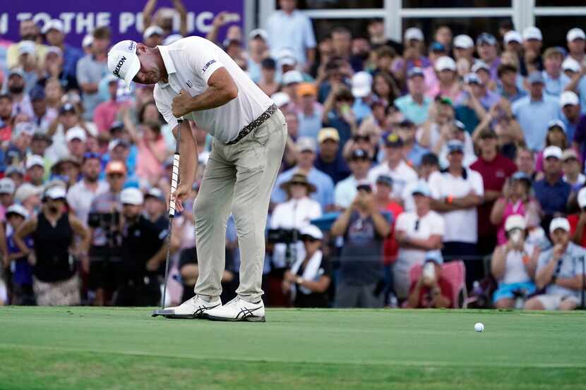 Lucas Glover putts on the 18th green during a playoff in the final round of the St. Jude...