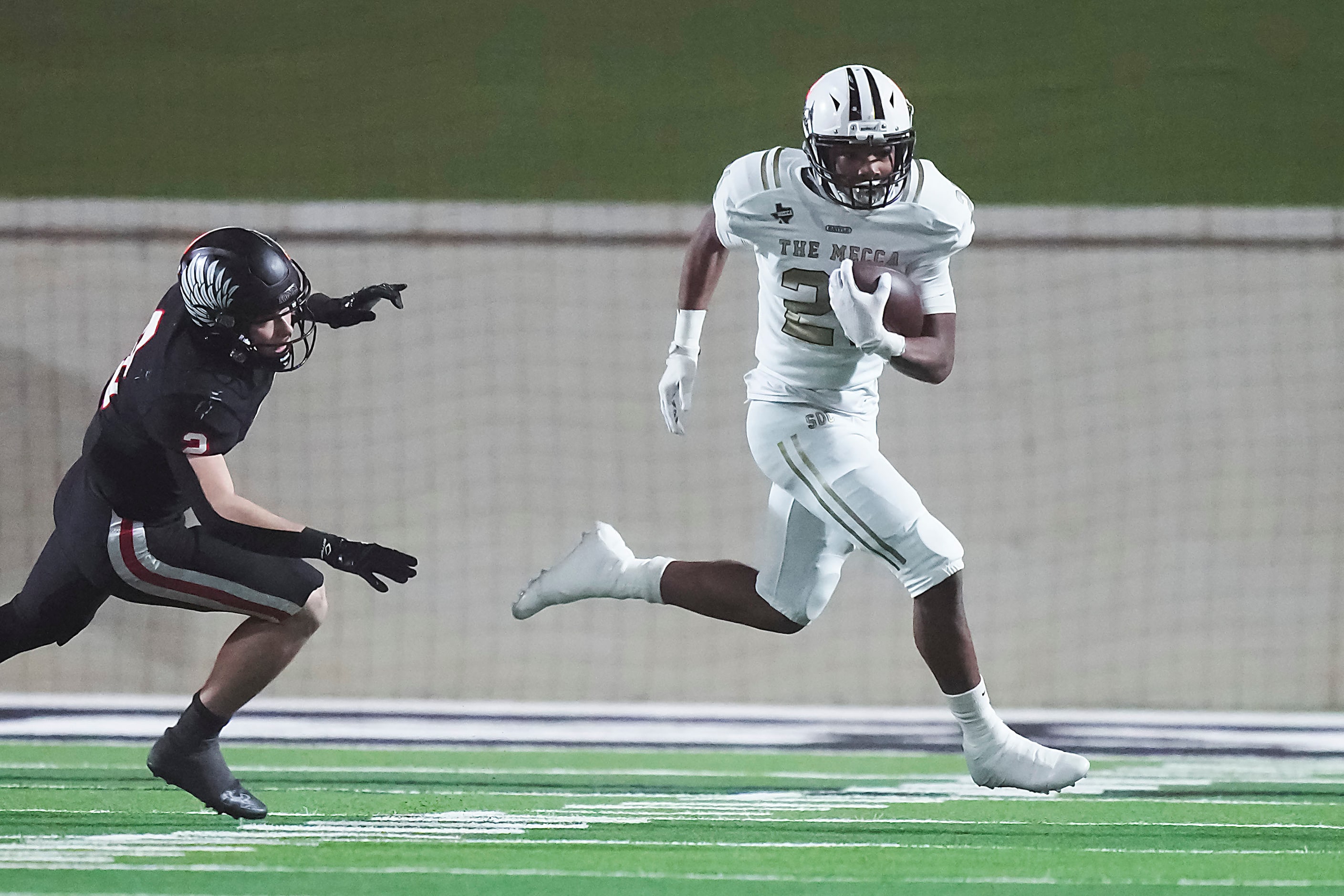 South Oak Cliff running back Danny Green (21) gets past Argyle defensive back Dax Horany (2)...