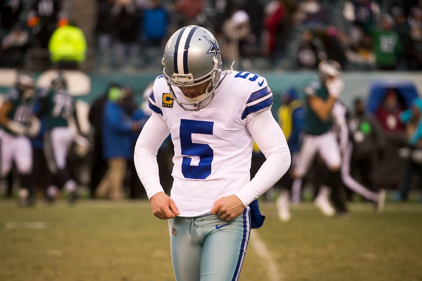 Dallas Cowboys kicker Dan Bailey walks off the field after missing a field goal attempt...