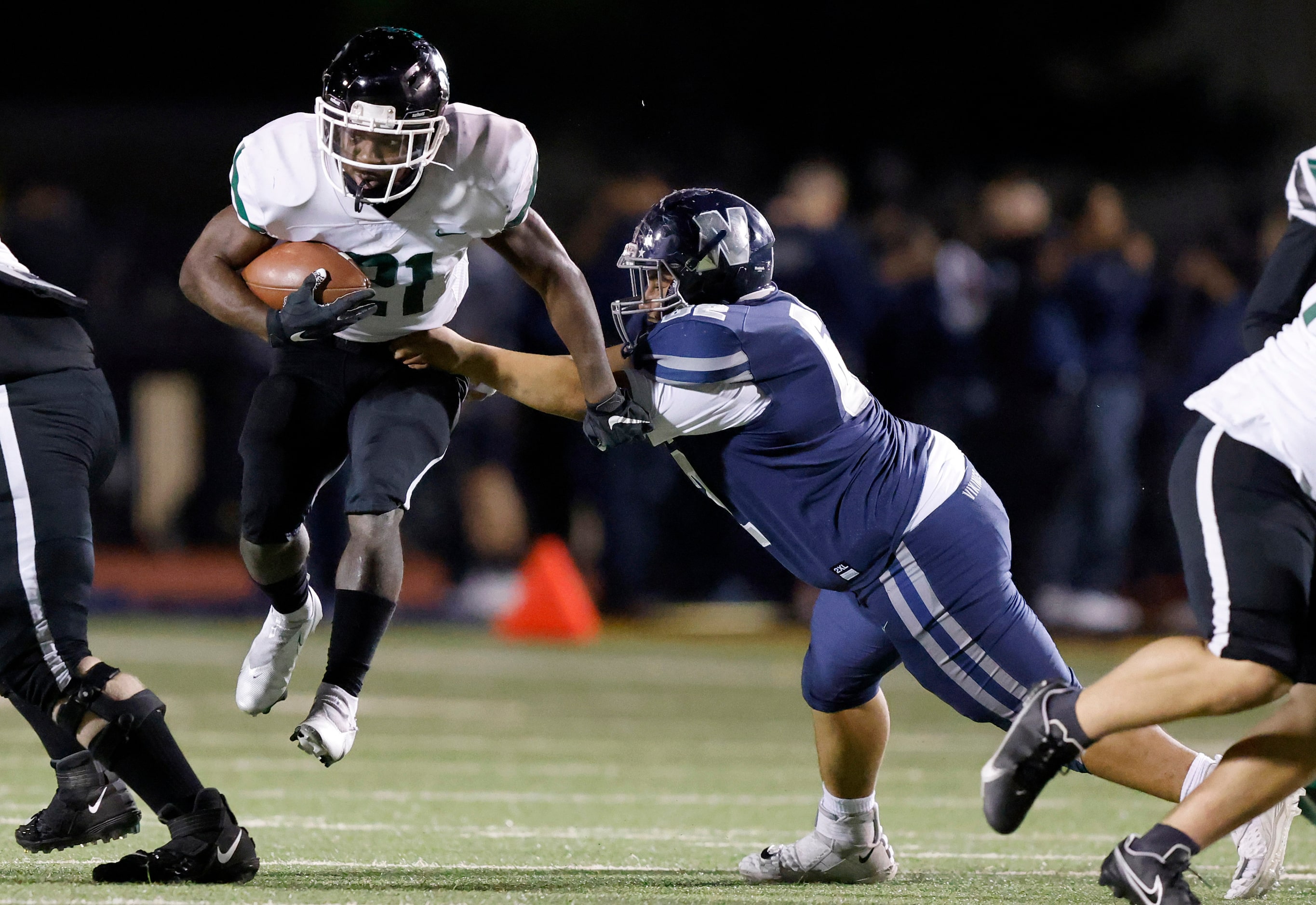 Richardson Berkner running back Omarion Barnes (21) carries the ball as Irving Nimitz's ...