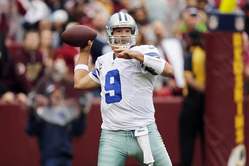 Dallas Cowboys quarterback Tony Romo (9) prepares to throw against the Washington Redskins...