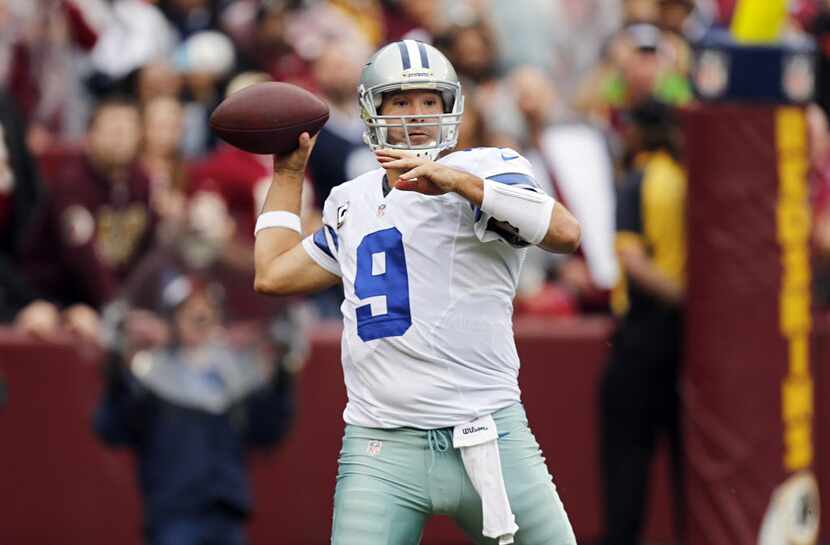 Dallas Cowboys quarterback Tony Romo (9) prepares to throw against the Washington Redskins...