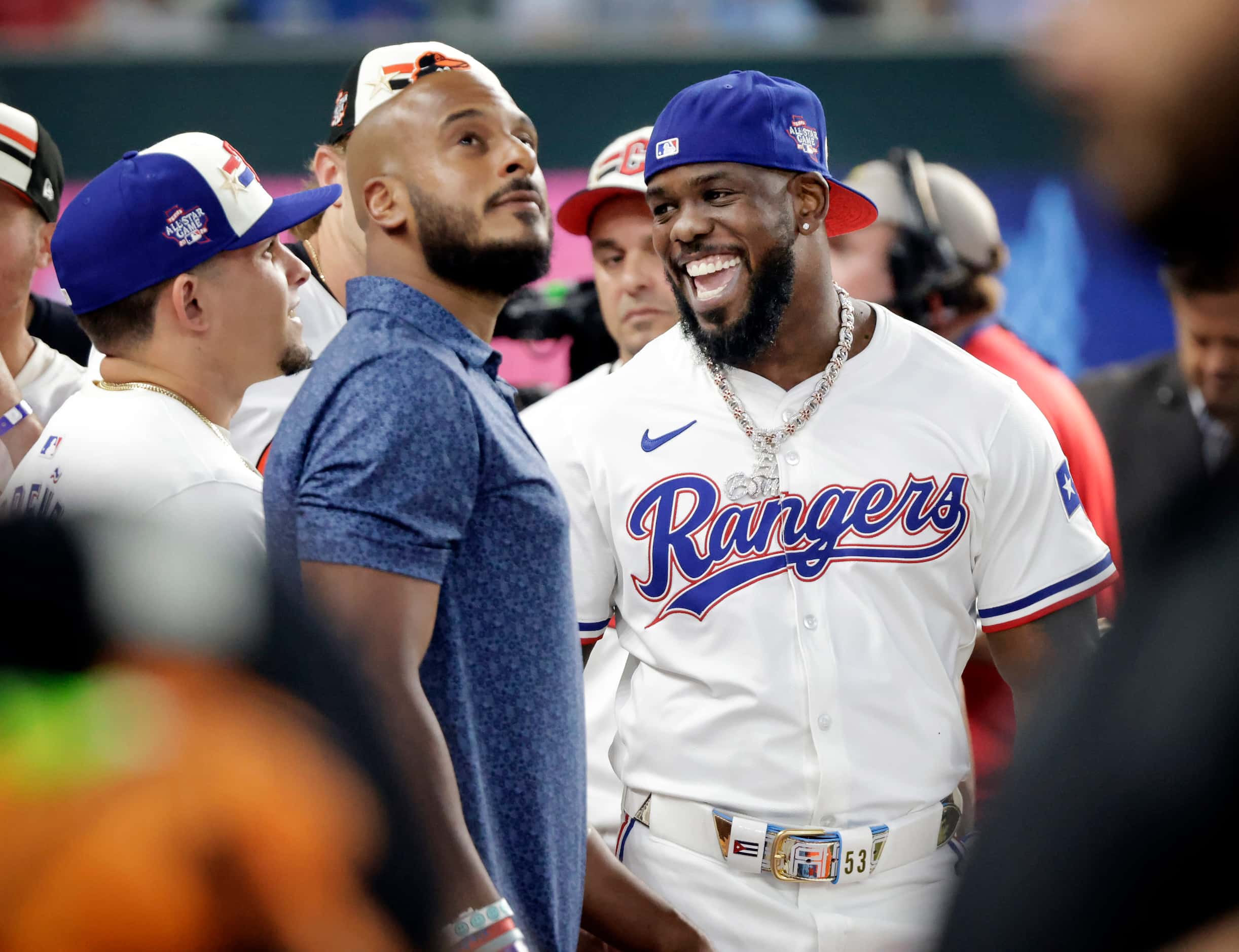 Texas Rangers outfielder Adolis Garcia laughs with teammates before his MLB All-Star Home...
