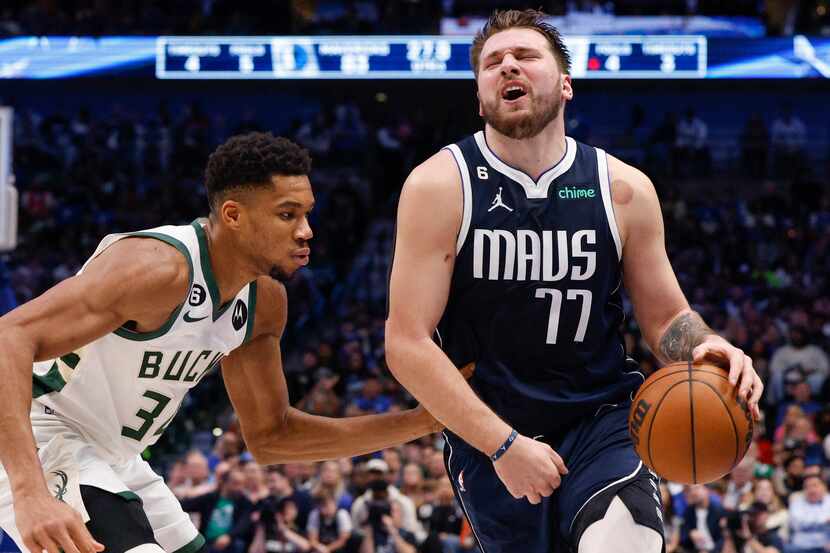 Dallas Mavericks guard Luka Doncic (77) reacts after being hit in the groin by Milwaukee...